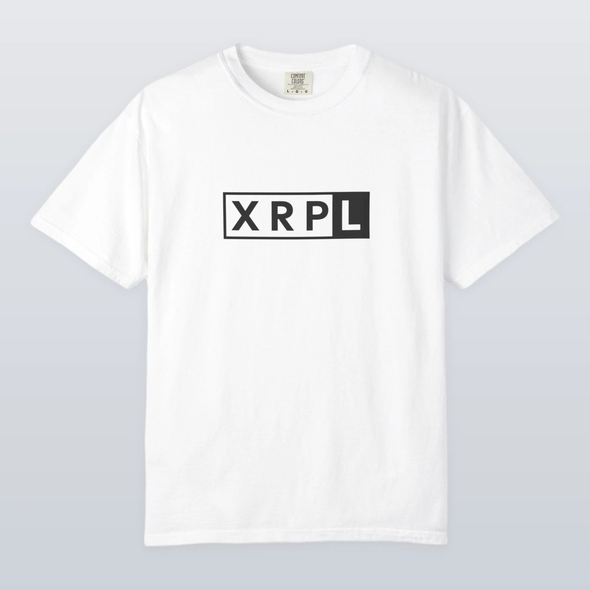 White XRP t-shirt with 'XRPL' logo on a light gray background