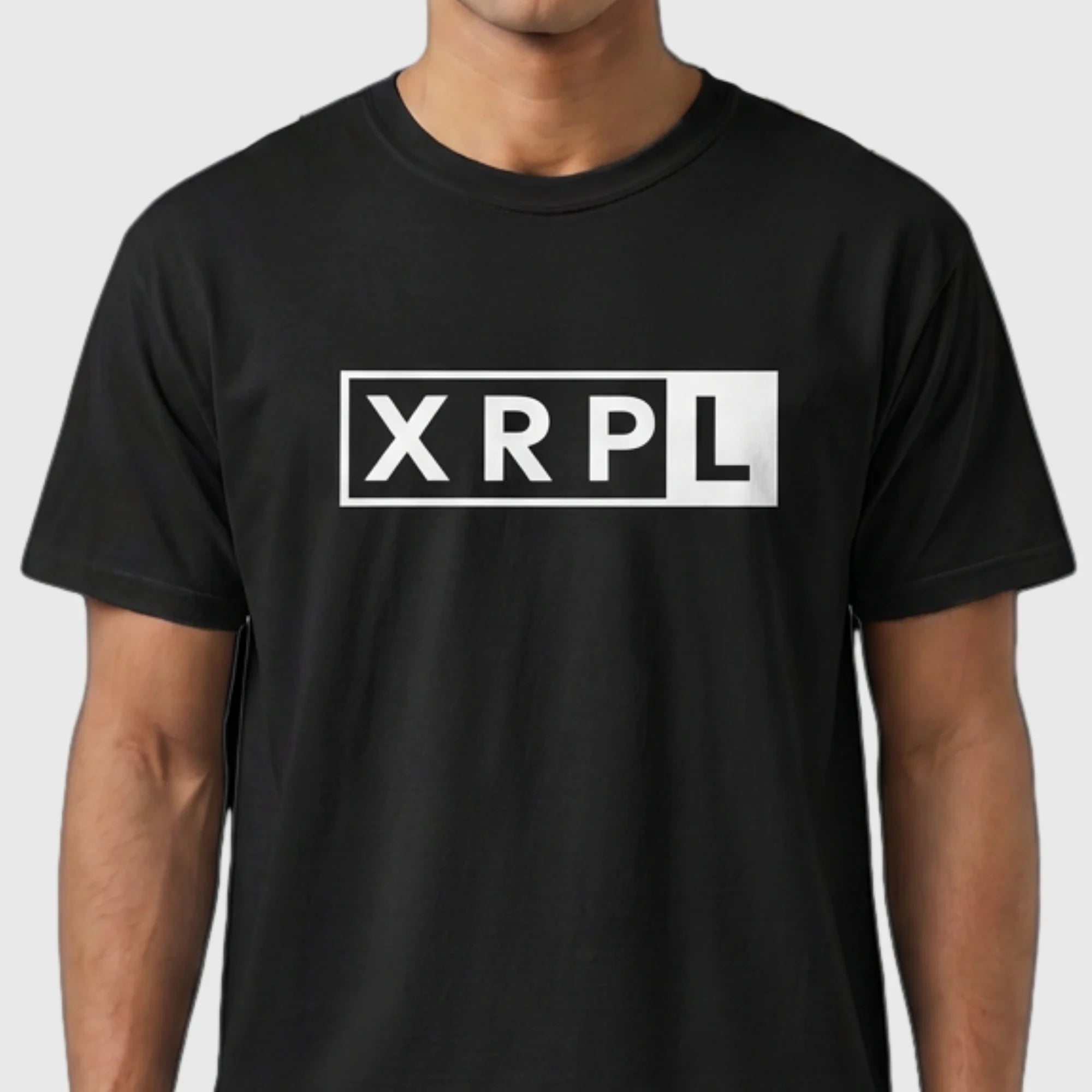 Black XRP t-shirt with 'XRPL' logo worn by a person on a white background